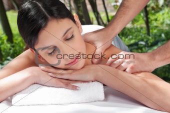 Attractive Caucasian woman getting massaged