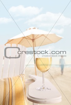 Glass of  wine on adirondack chair at the beach