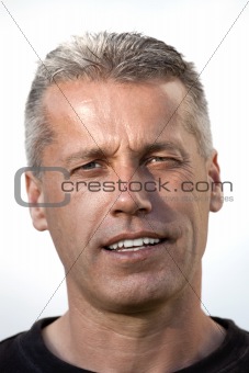 portrait of a middle aged man looking at camera - isolated on white