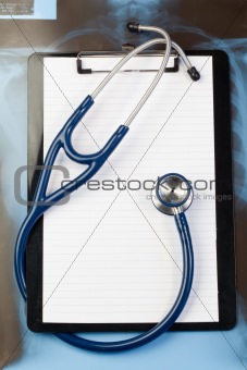 Note pad and blue stethoscope