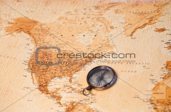 World map with compass showing North America
