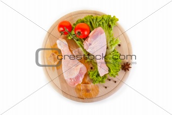 Fresh and frozen chicken legs with vegetables 