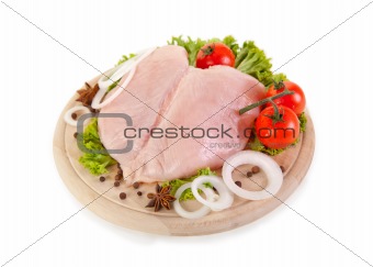 Fresh raw chicken breasts with vegetables 