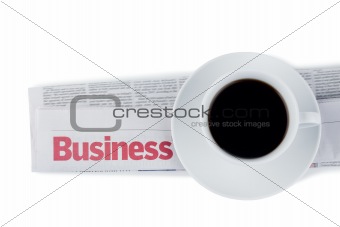 Folded newspaper and cup of coffee
