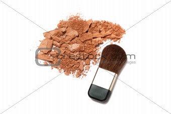 Cosmetic powder brush and crushed blush palette isolated on white