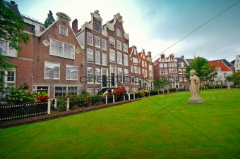 Old houses and sculpture on the lawn, Amsterdam