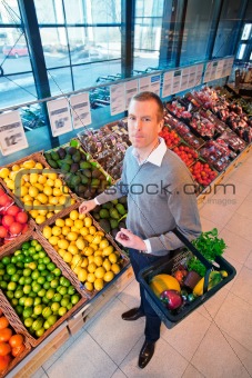 Portrait of a man buying fruits