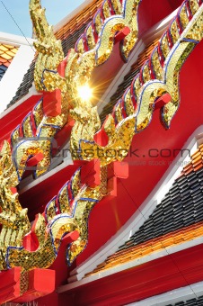 detail of ornately decorated temple roof in bangkok