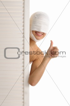 Satisfied woman with bandaged head