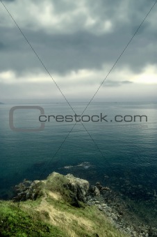 Storm clouds over the island in sea
