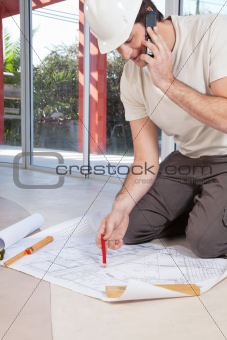 Architect working on blueprint