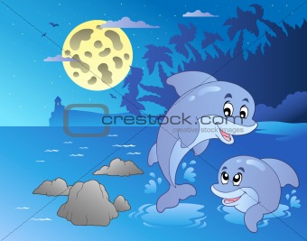 Night seascape with happy dolphins