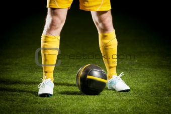 Soccer ball and a feet of a soccer player