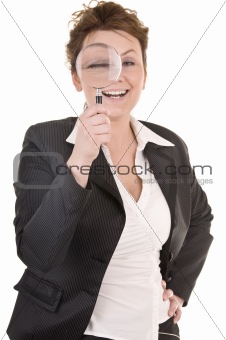 Businesswoman Looking Into A Magnifying Glass