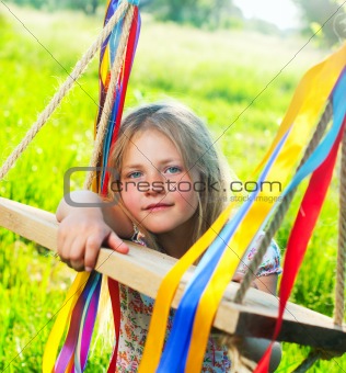 Young girl on swing