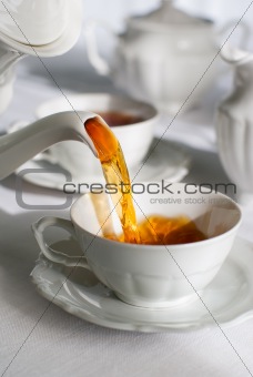 Pouring tea.