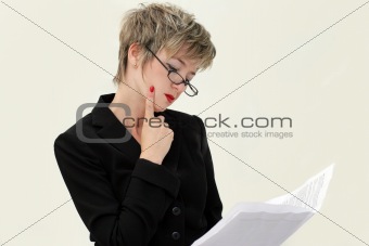 Businesswoman reading a paper