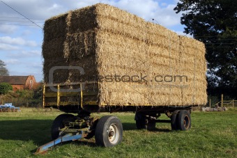 straw hay bales on a trailer