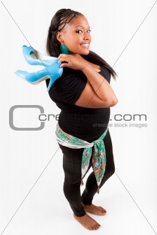 Beautiful  African American woman holding  a pair of shoes
