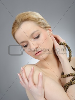 Pretty womans face with pure healthy skin and indian mala