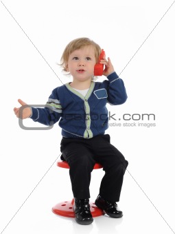 Cute little child speaking on the cell phone. isolated