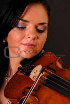 beautiful girl paying the violin
