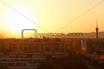 Sunset at suburbs with the silhouettes of the city