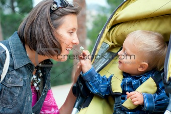Boy with mother in the park