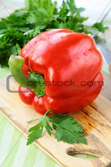 large red bell paprika peppers on a cutting board