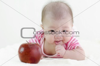 Baby girl with an apple