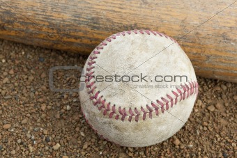 A worn baseball and bat