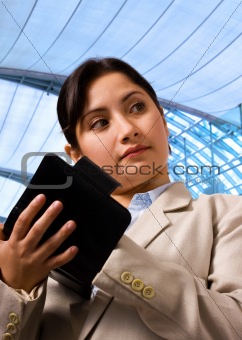 Business Woman Writing her Schedule in Her Organizer
