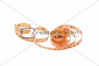 Rolled up measuring tape on white background
