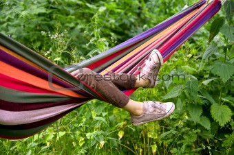 child lying in a hammock