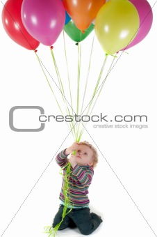 Little cute girl with multicolored air balloons
