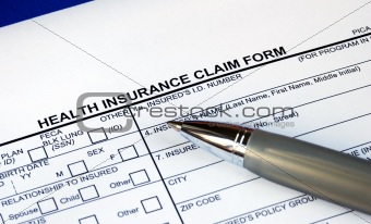 Filling the health insurance claim form isolated in blue