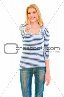 Smiling beautiful teen girl showing  thumbs up gesture
