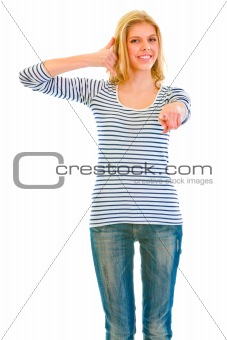 Smiling  teen girl showing contact me gesture and pointing finger at you
