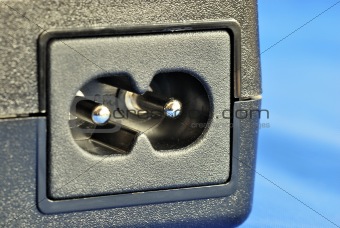 Close up view of a electric jack isolated on blue