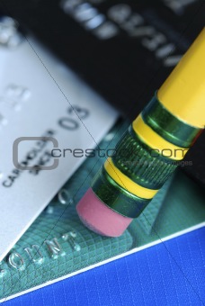 Erase the debt on the credit cards isolated on blue