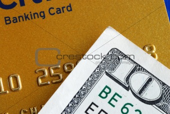 Ten dollar bill and a credit card concepts of finance