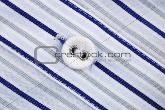 Close up view of a button from a shirt