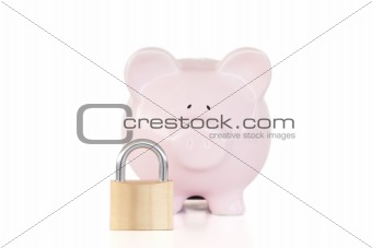 Pink piggy bank and padlock