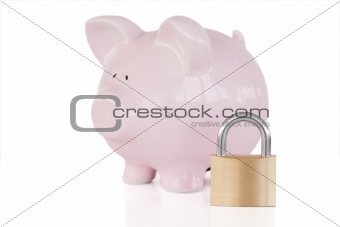 Pink piggy bank and padlock