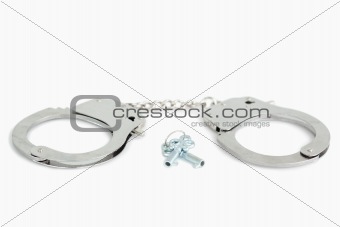 Metallic handcuffs and keys