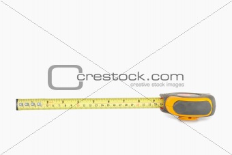Yellow measuring tape partly unrolled