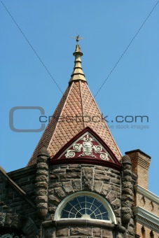 Weather vane on top of an old building