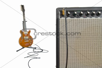 closeup of amplifier and electric guitar in background
