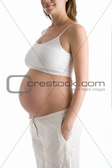 Pregnant woman with belly exposed smiling