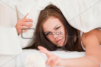 Unhappy brunette waking up